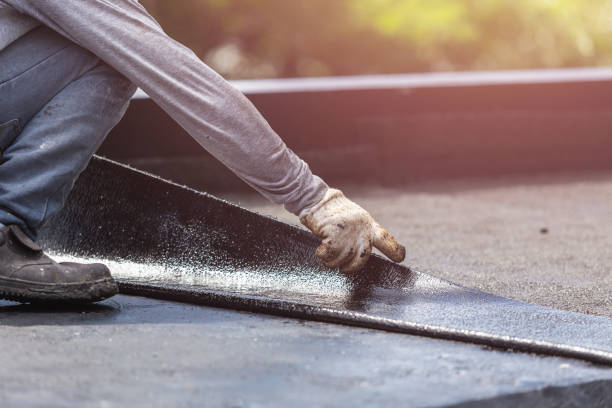 Professional Basement Waterproofing technician working in Rush, NY
